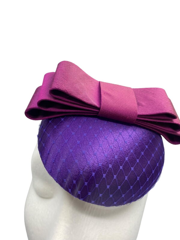 Cadbury purple satin hat with purple satin bow.